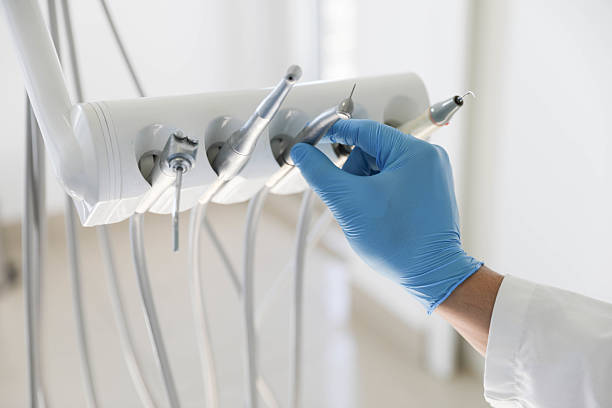 Professional Tooth Extraction technician working in Bonadelle Ranchos, CA